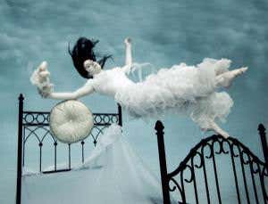 Illustration of woman in a white gown floating above a bed