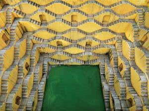Labyrinthine M. C. Escher stairs line vast Indian well