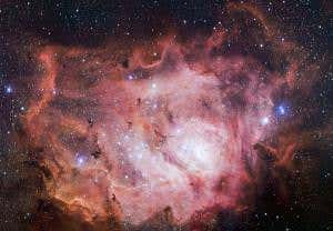 Swim among newborn stars in this vast lagoon of dust