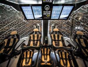 SpaceX unveils sleek, reusable Dragon crew capsule