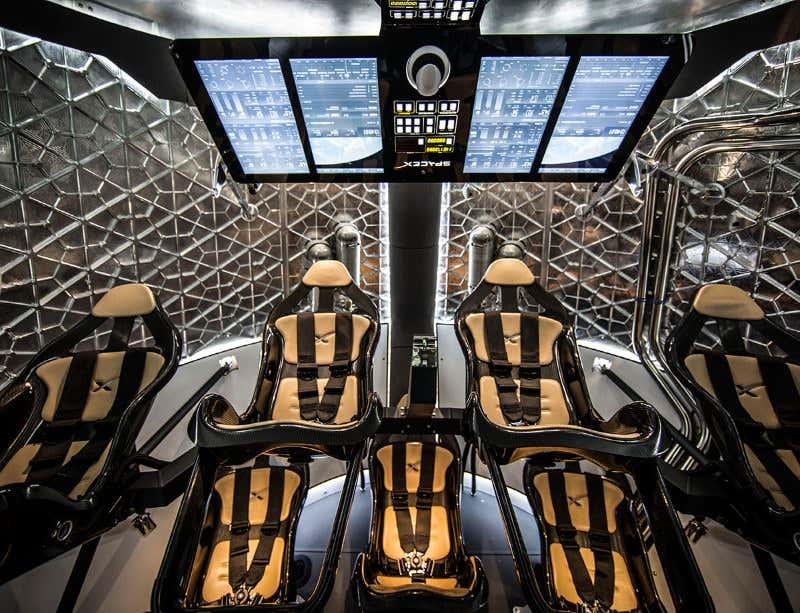 SpaceX unveils sleek, reusable Dragon crew capsule