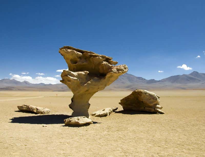 Vast rock arches sculpt themselves out of sand