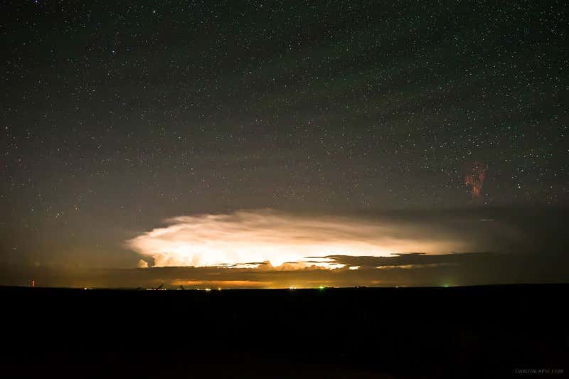 Red sprites and gravity waves dance in a stormy sky