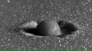 Crashing drops make mini-Armageddon craters