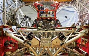 Giant robot eyes scan stars for dust