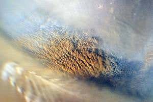 Mars volcanoes launch dust storms like a skate ramp