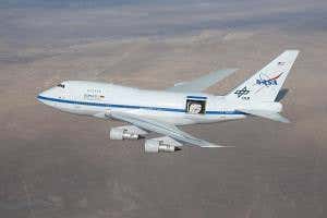 Chasing Pluto's shadow in a Boeing 747