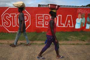 Bolster health systems in poor countries or see another Ebola