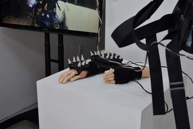 Model hands on a plinth with fingerless gauntlets studded with spikes