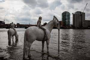 Underwater horse sculptures revealed at low tide in the Thames