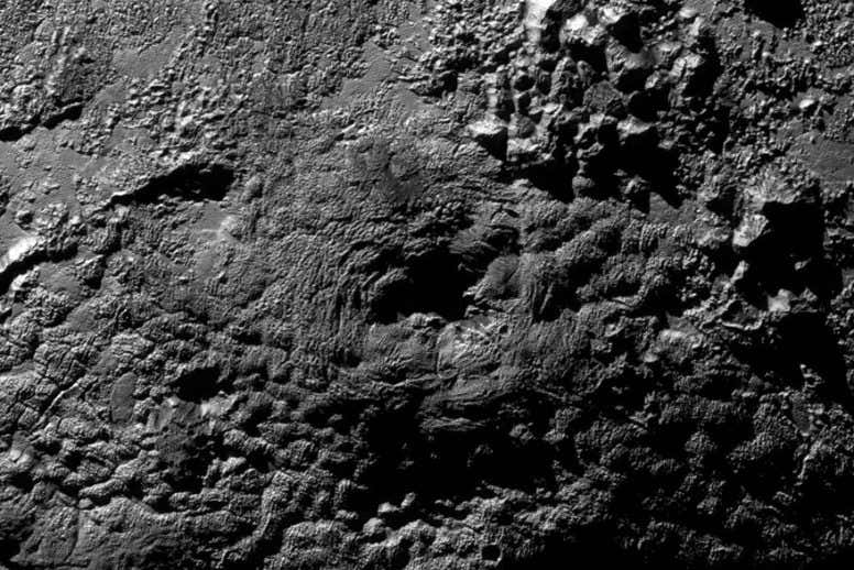 Pluto surprises with ice volcanoes and alien weather