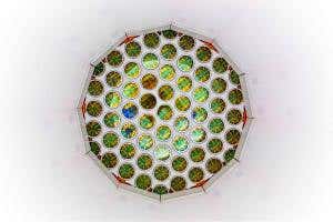 Dark matter's true face could be unmasked by pairs of dead stars