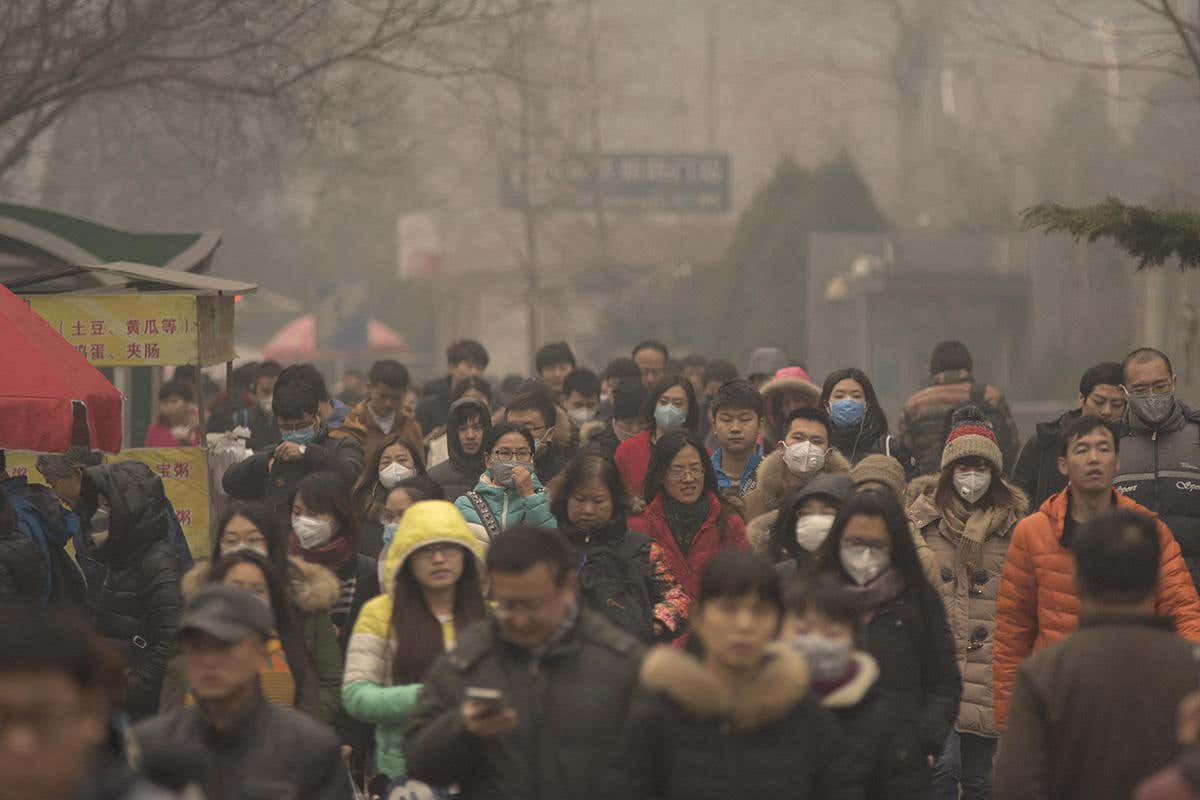 a crowd of people in clearly smoggy dirty air, Beijing