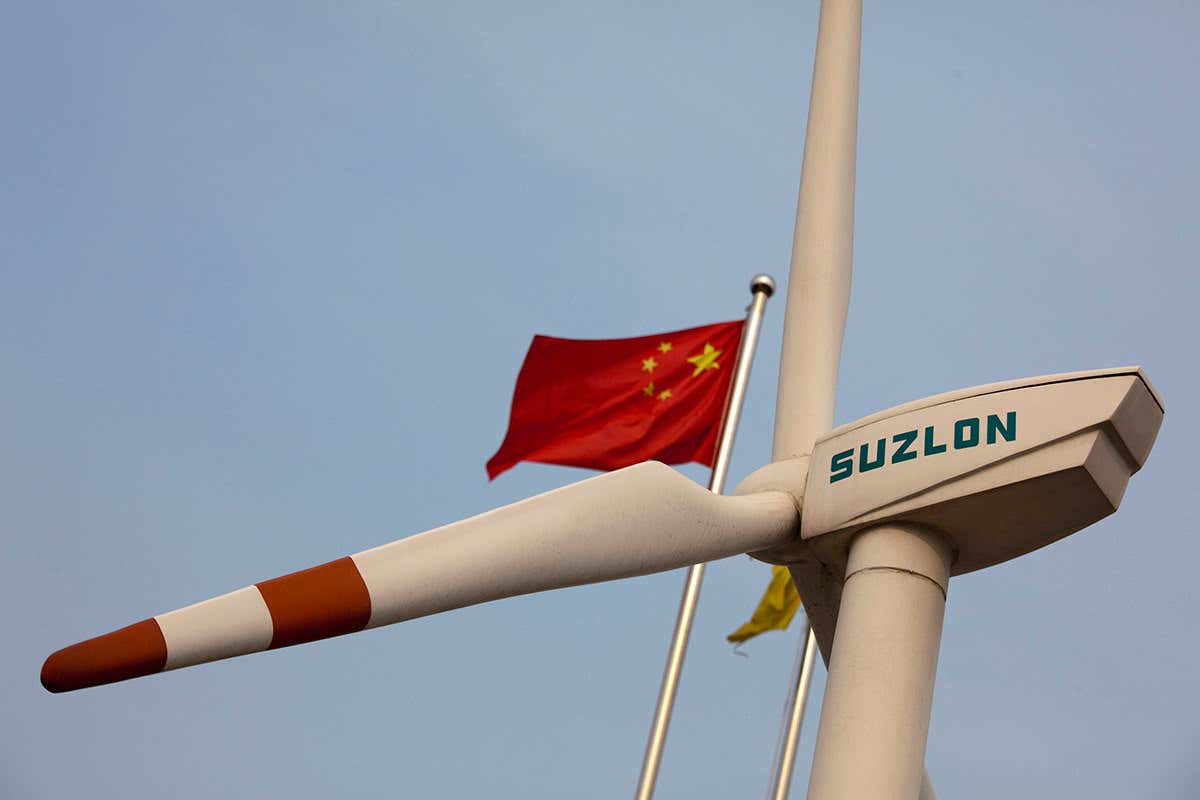A wind turbine flying Chinese flag