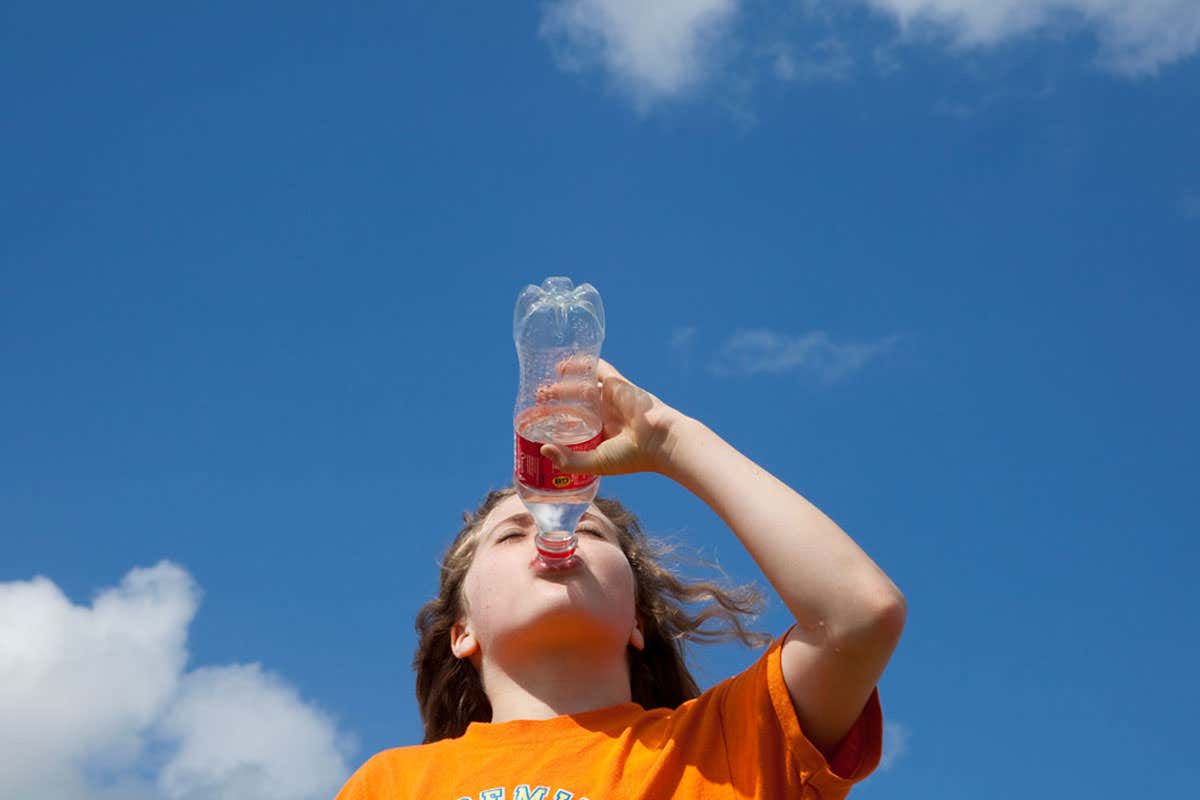 A child drinking a fizzy drink