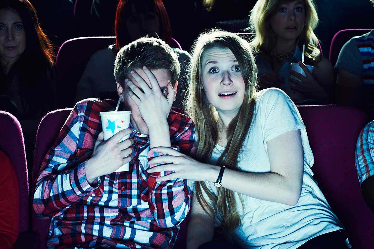 A couple scared while watching a film