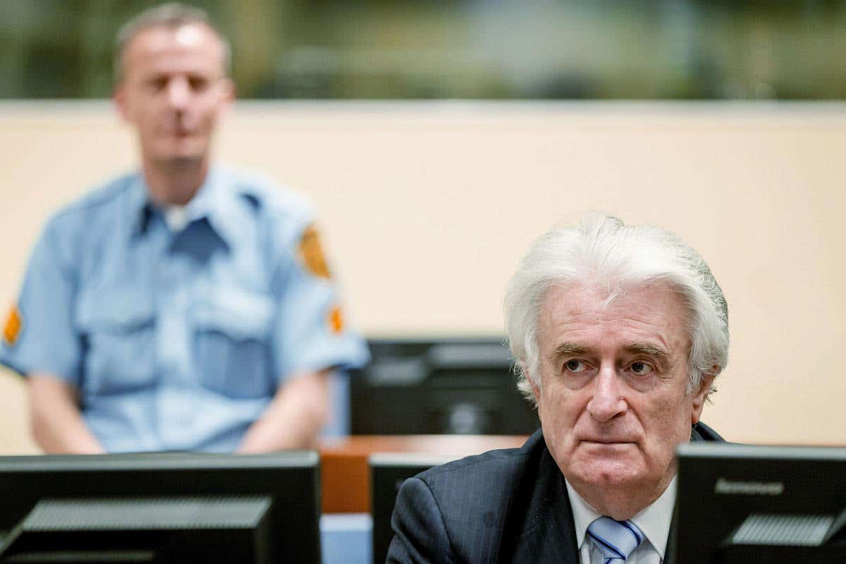 Bosnian Serb wartime leader Radovan Karadzic sits in the courtroom for the reading of his verdict at the International Criminal Tribunal for Former Yugoslavia (ICTY) in The Hague, on 24 March, 2016