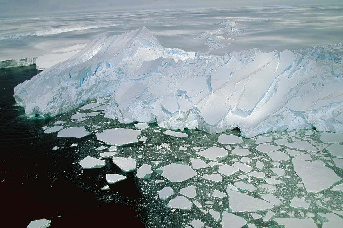Ice breaking off floating shelves and drifting at sea