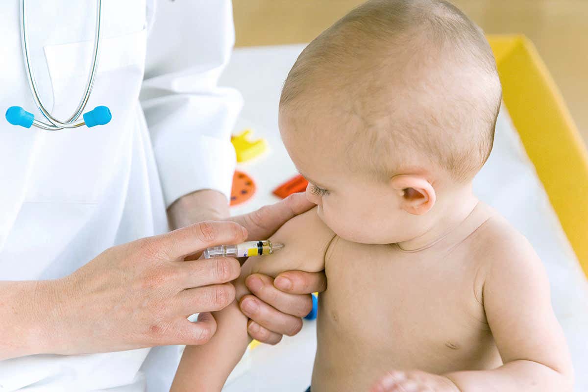 7 months old baby receiving vaccination
