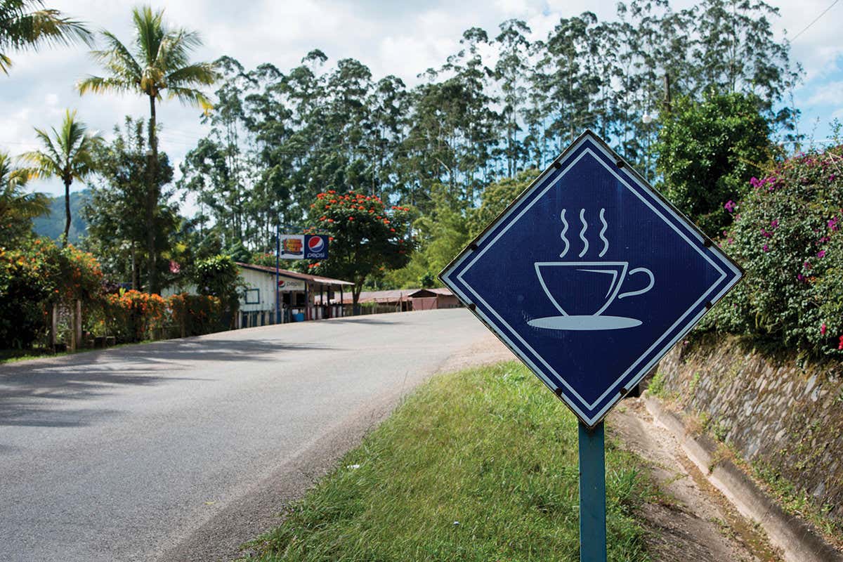 A road with a coffee sign