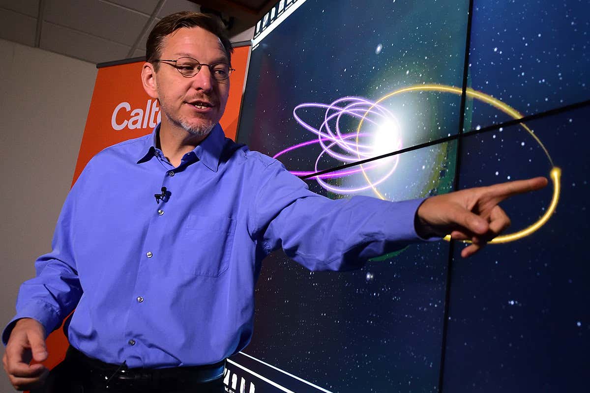 Cal Tech Astronomer Mike Brown points out the 'Predicted Orbit', in yellow, of the 9th Planet at the Caltech Seismology Lab
