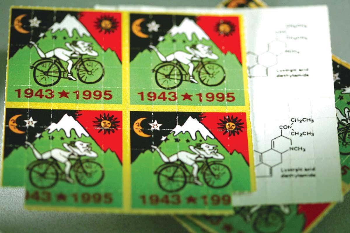 LSD tablets packaged in a sheet with colour illustration printed over it