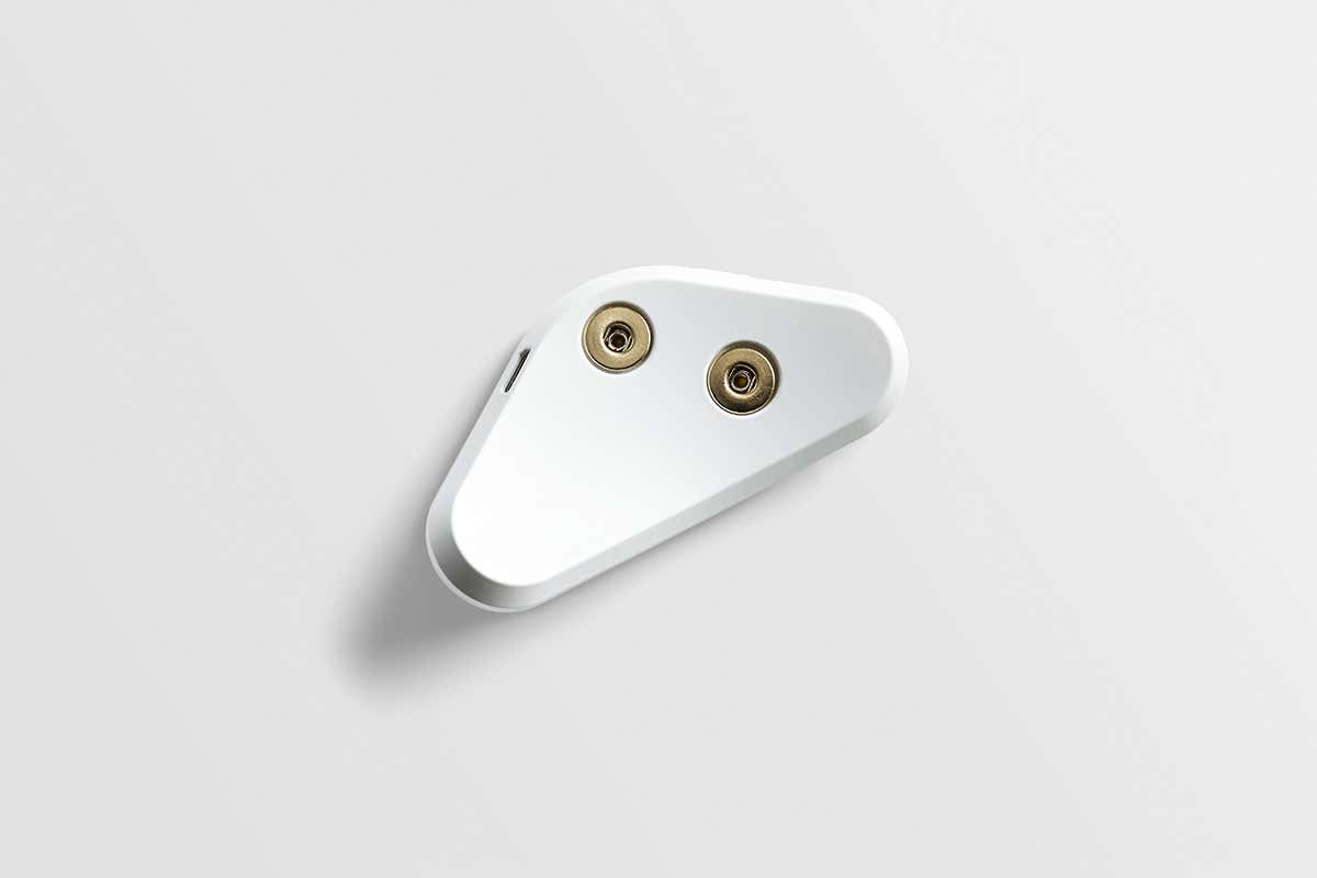 The white plastic triangular device