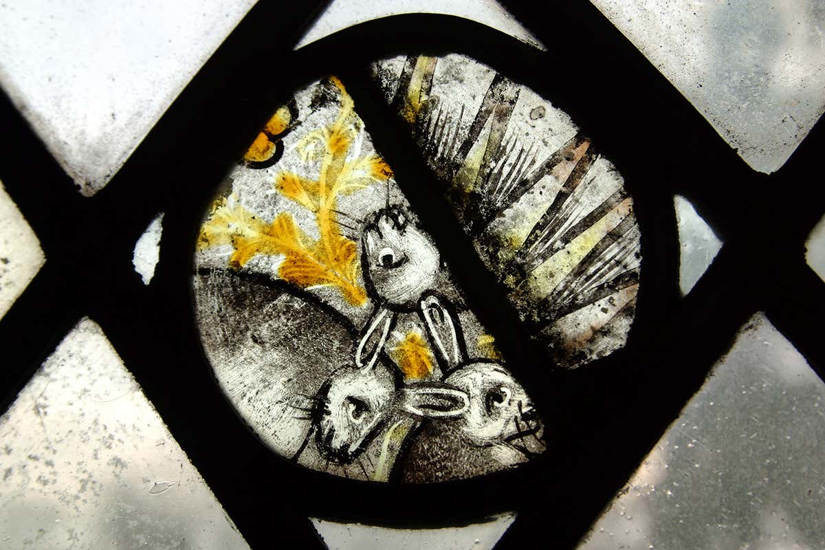 Three hares image in medieval stained glass: Holy Trinity Church, Long Melford, Suffolk