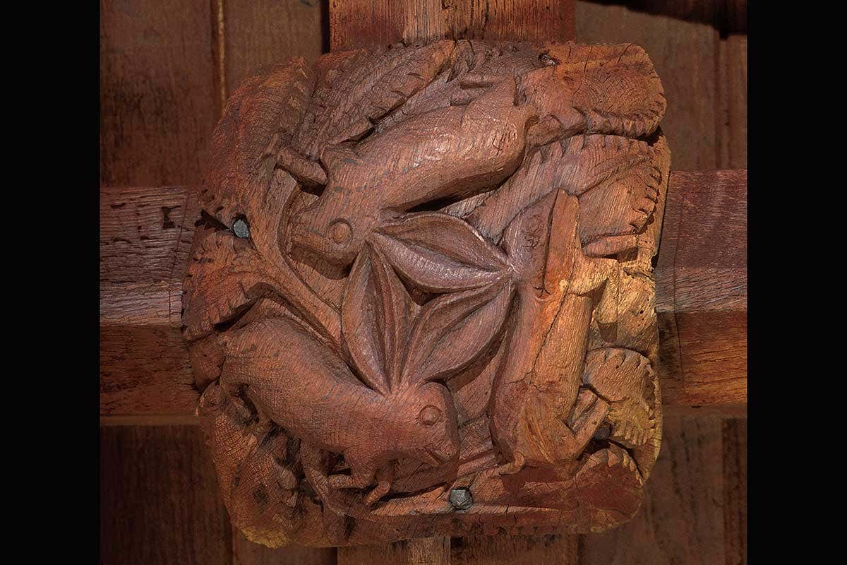 Three hares image on medieval roof boss, South Tawton, Devon, UK