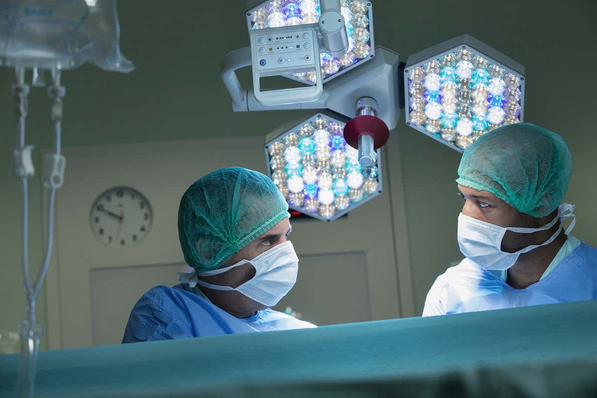 Two surgeons exchanging a glance in the operating theatre