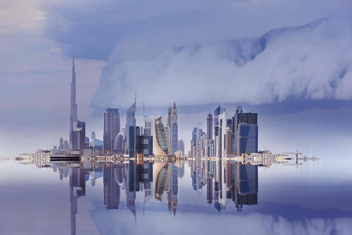 Dubai skyline reflected, stormy sky, seen from old town