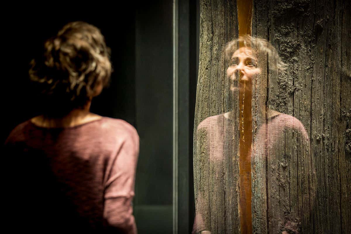 The actor Zoe Wanamaker facing a screen that gives a misty half reflection of herself