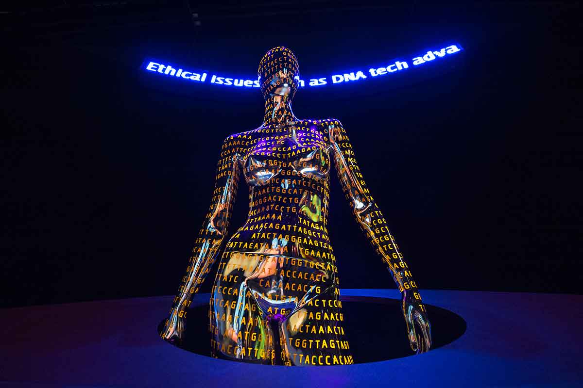 Sculpture of human figure covered in letters 