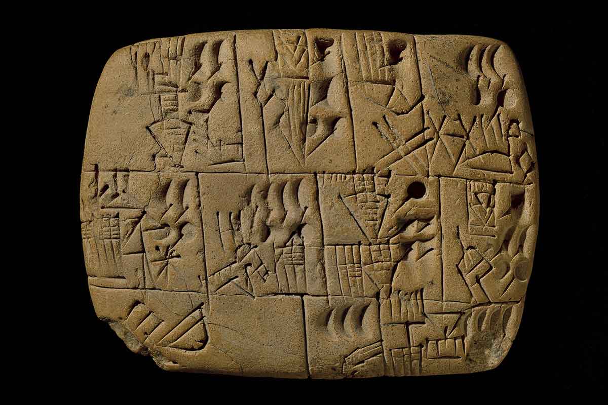 Clay tablet with cuneiform writing on it