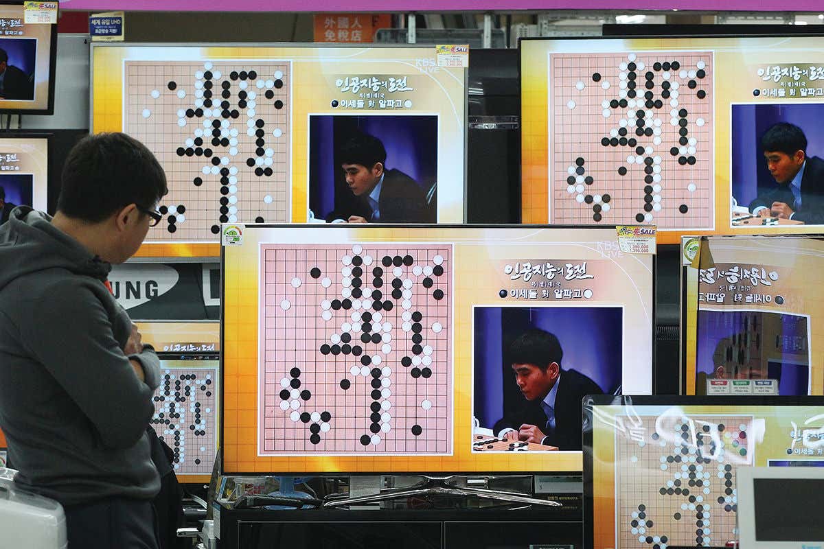 TV screens showing Go match