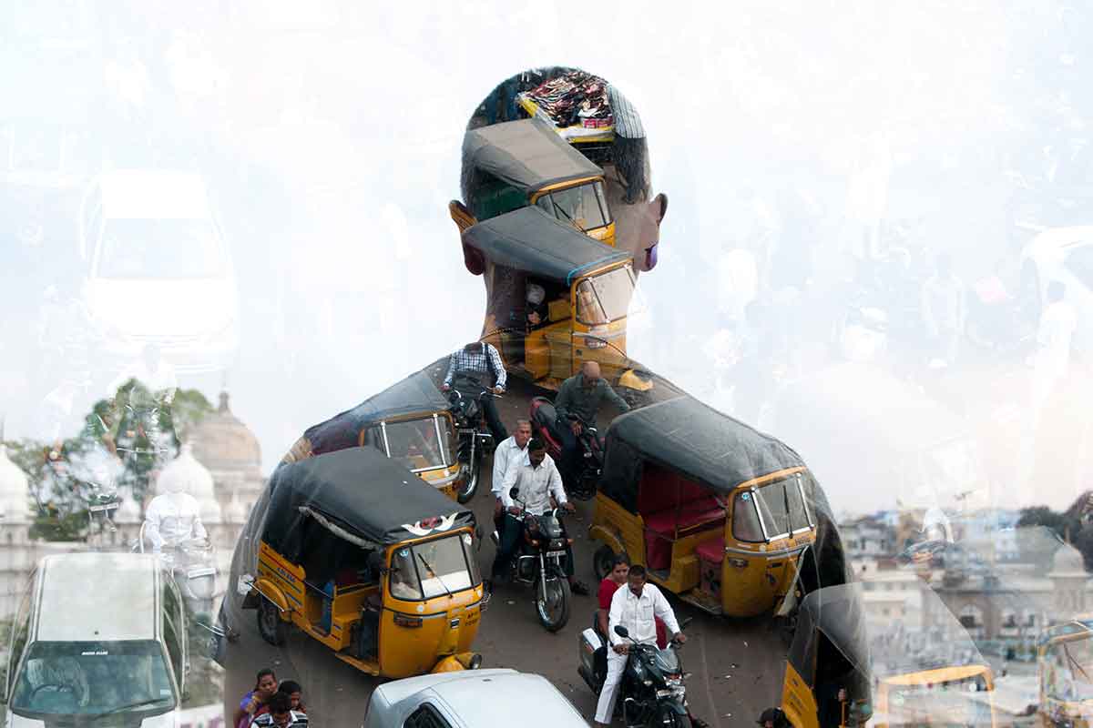 Partly transparent silhouette of man against a crowded streetscape