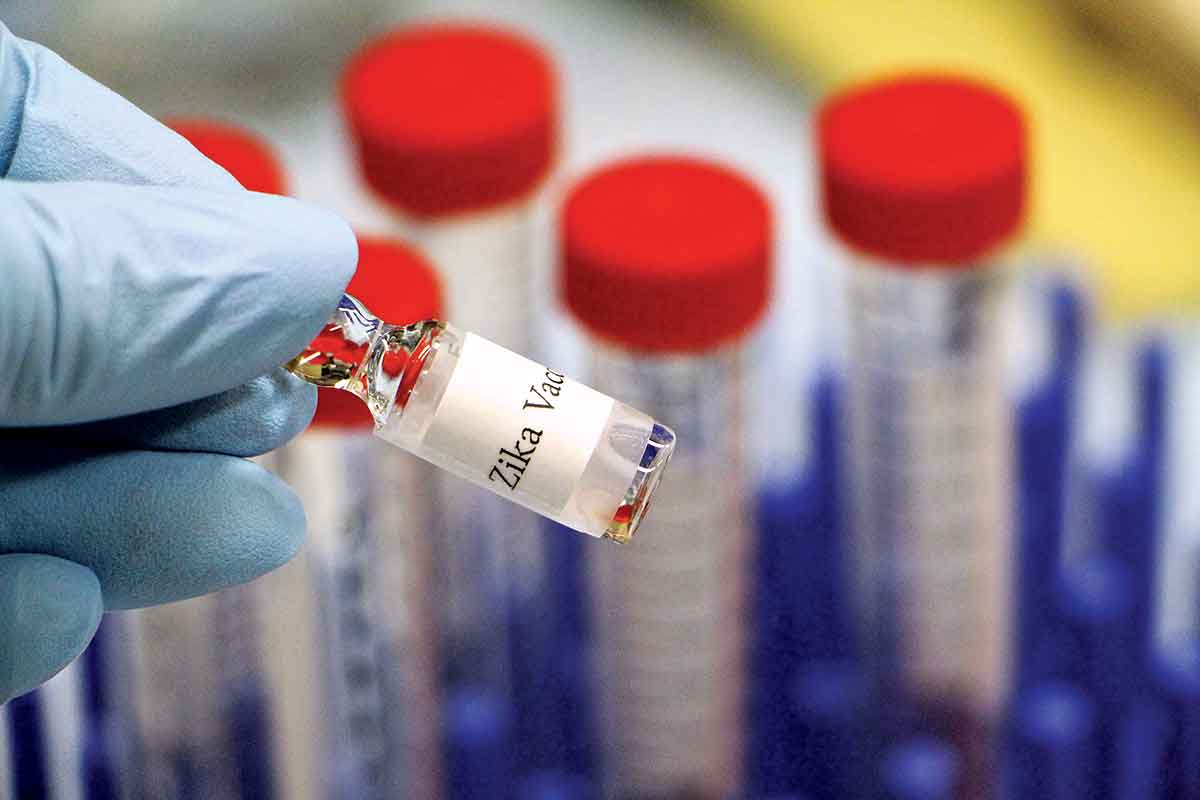 Test tubes with red tops, containing Zika vaccine