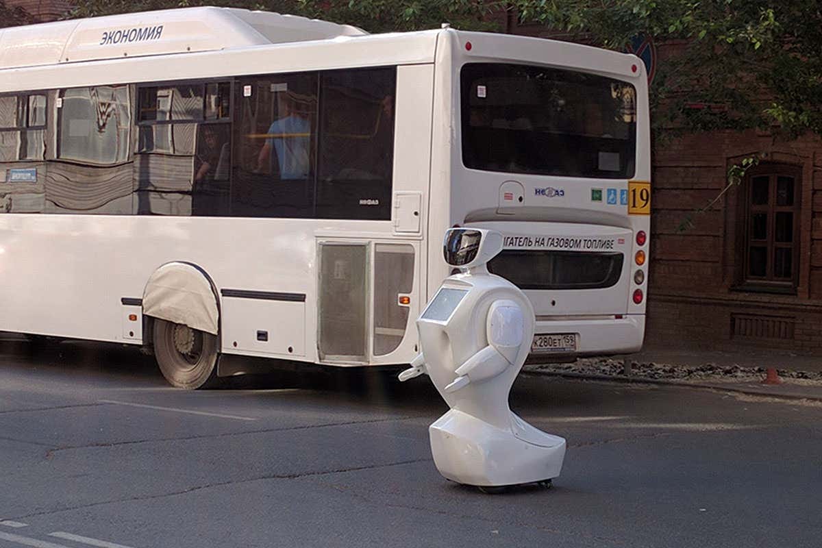 Promobot robot stands in the middle of a road