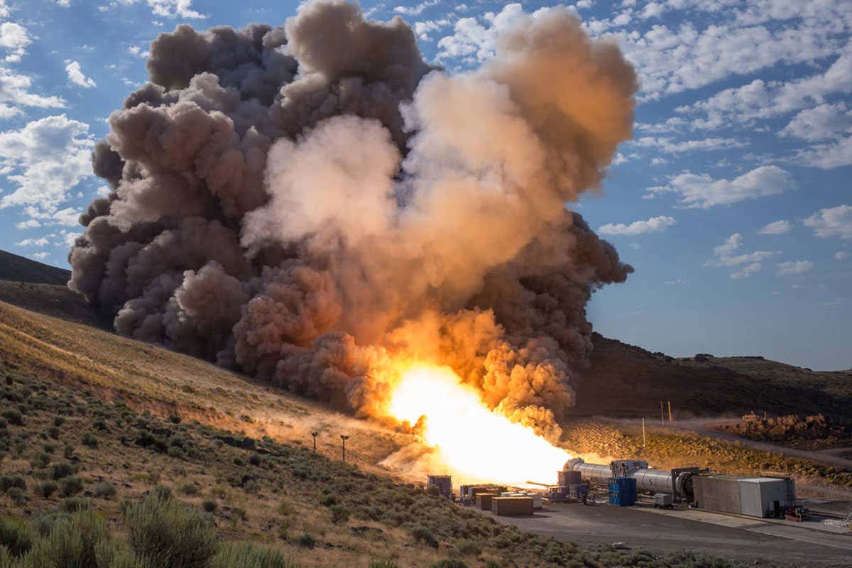 Rocket booster fires at bottom of valley
