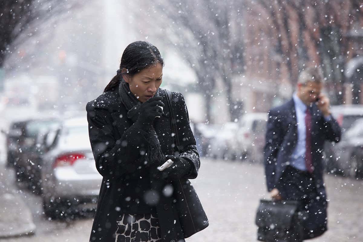 Woman coughs in snow