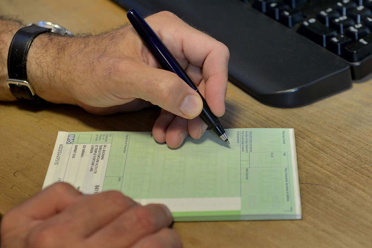 someone writing a prescription