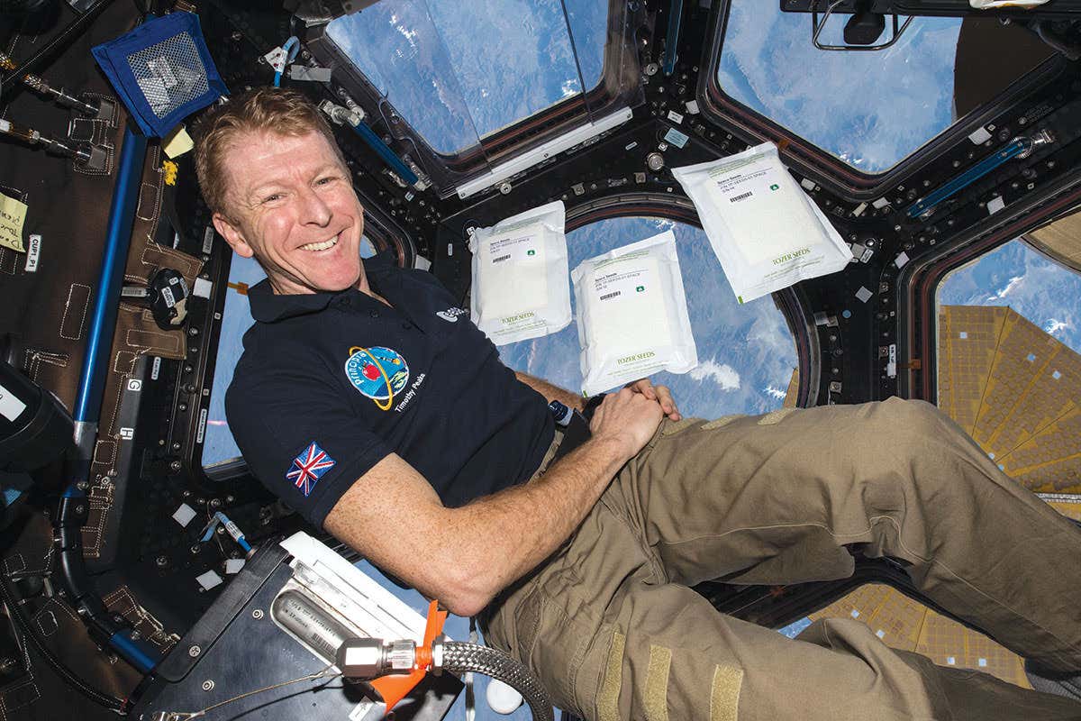 tim peake smiling, and reclining in microgravity presumably on the ISS