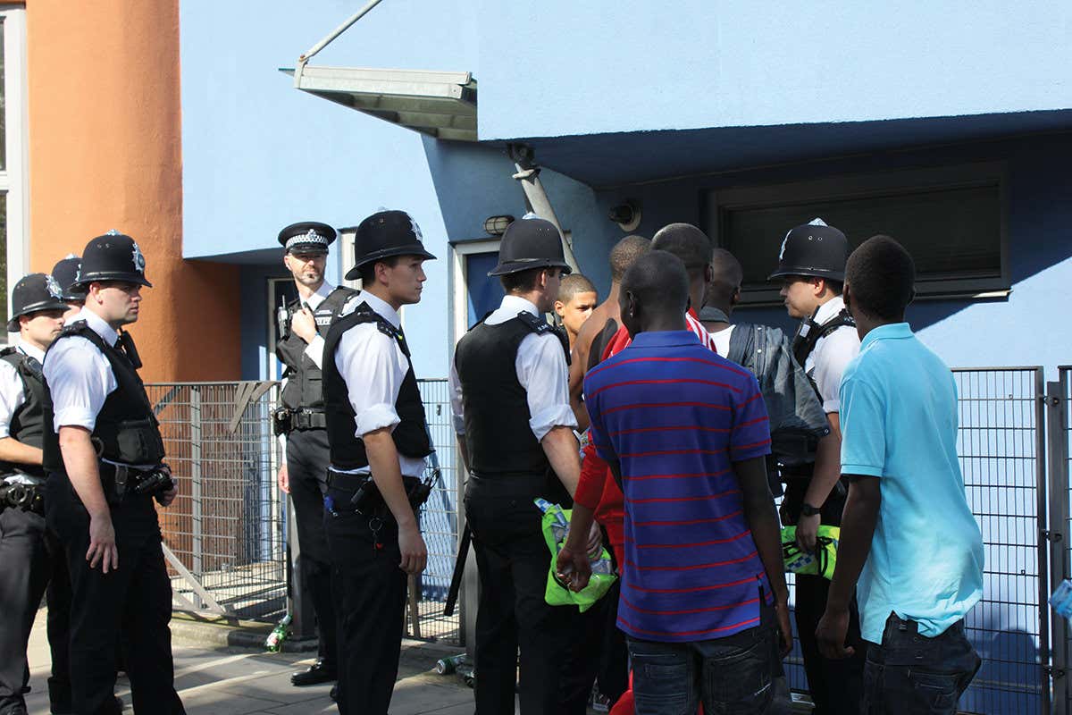 British policemen questioning black youths