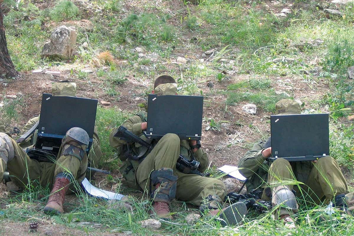 soldiers with laptops