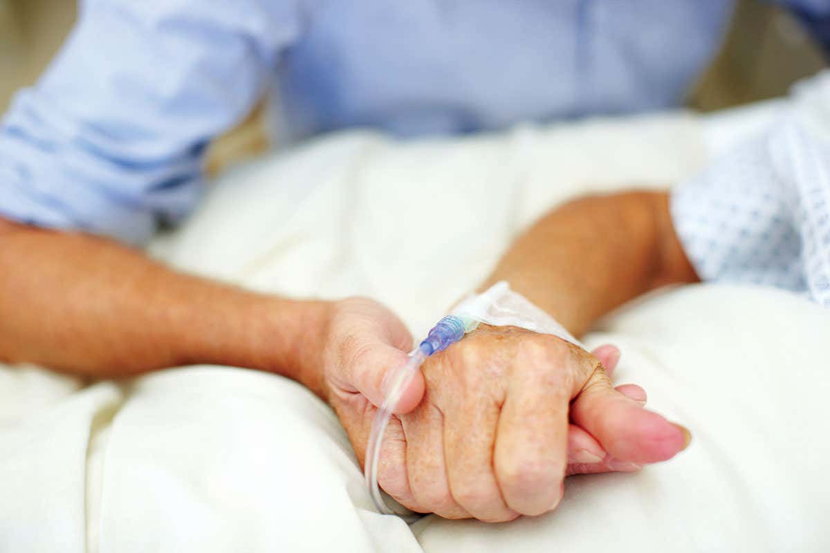 man holding patient's hand