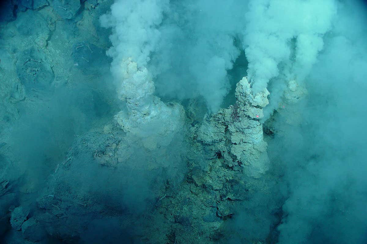 Rock chimneys spew what looks like smoke although this is actually on the seabed