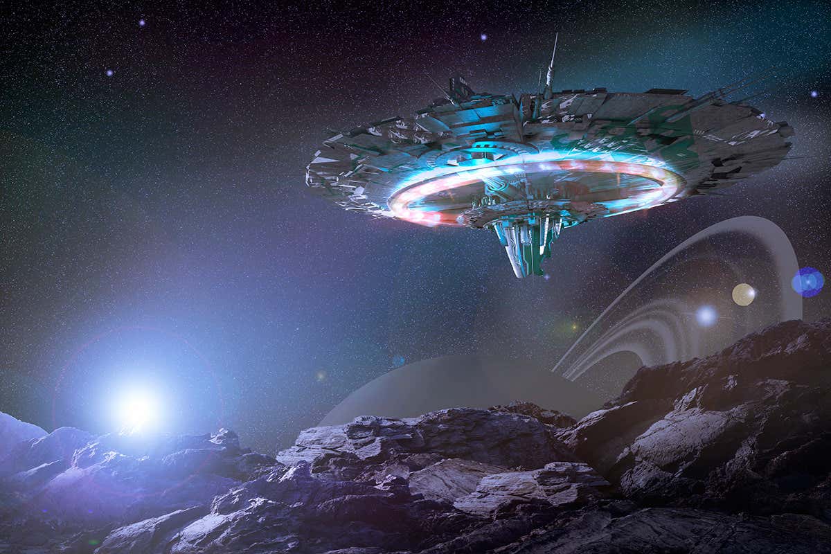 Flying-saucer-like craft swoops over rocky terrain with Saturn-like world on the horizon