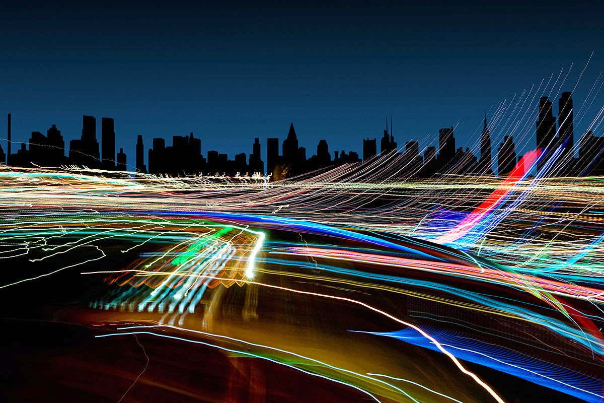 Scene-setter of a New York skyline at night with whooshy lights