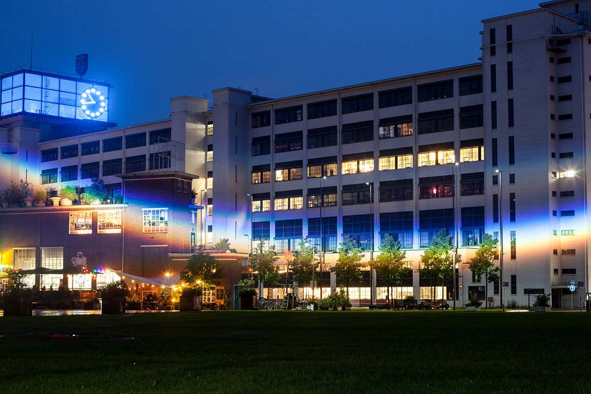 Rainbow projected across building opposite exhibition space