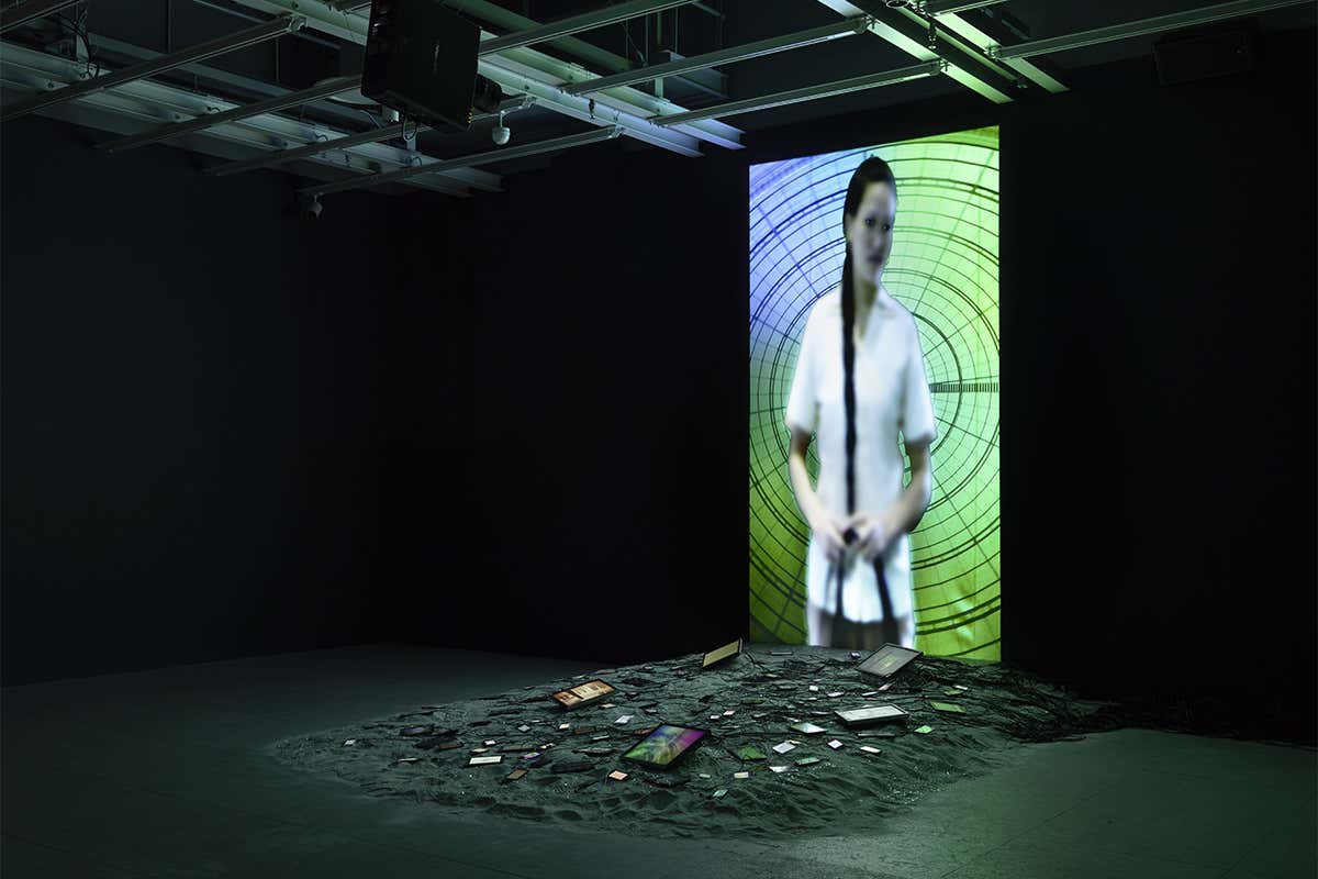 Vertical screen with various mobile devices scattered in front it